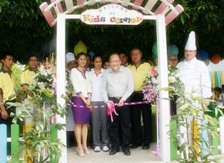 Supachayanont cuts the ribbon during the opening of the Kids Corner.